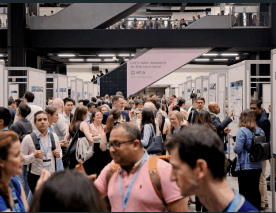 Photo of busy research convention with people interacting