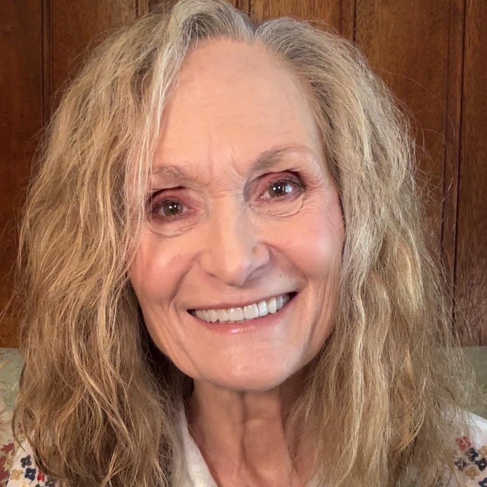 picture of Beth Grant smiling, looking luminous
