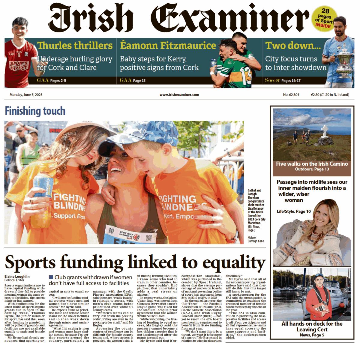 An image of the front page of the Irish Examiner print edition from June 5. There is an image of a woman on the front page with her two children wearing Fighting Blindness orange t-shirts.