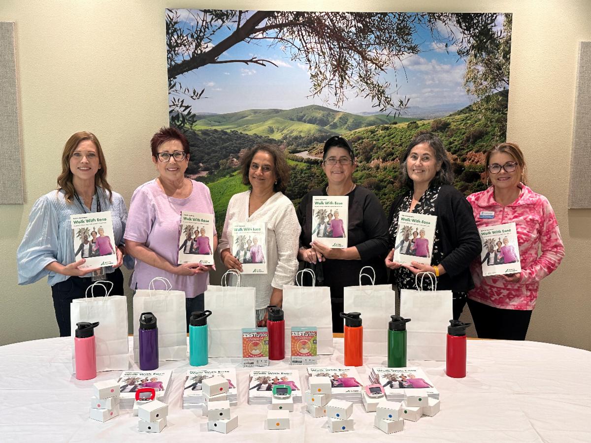 Pictured L to R: Candace Gray (Senior Center staff), Susan Blumert, Anjana Prabhakar, Erin Huey (Walk With Ease instructor), Nancy Garcia Council On Aging), and Lisa Hemingway holding "Walk with Ease" books