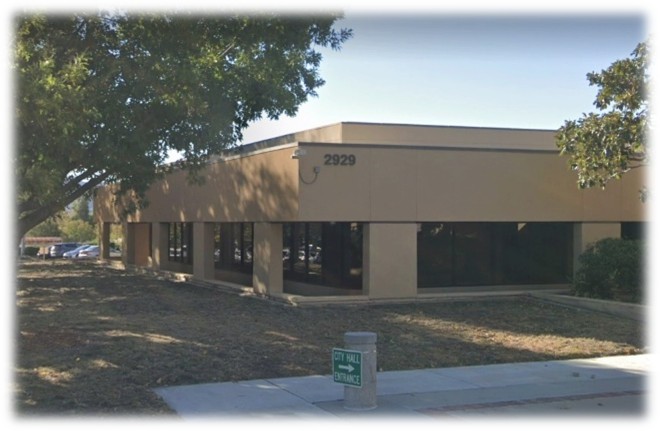 before picture of City Hall showing dirt with no plantings