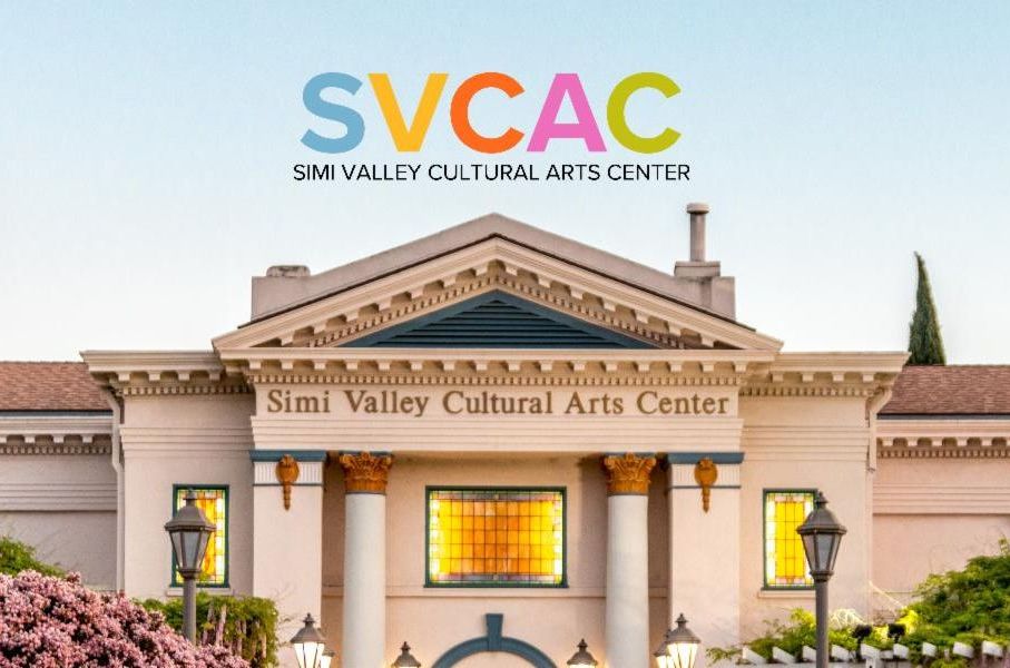 Simi Valley Cultural Arts Center building from front showcasing staircase entry and stained glass windows.