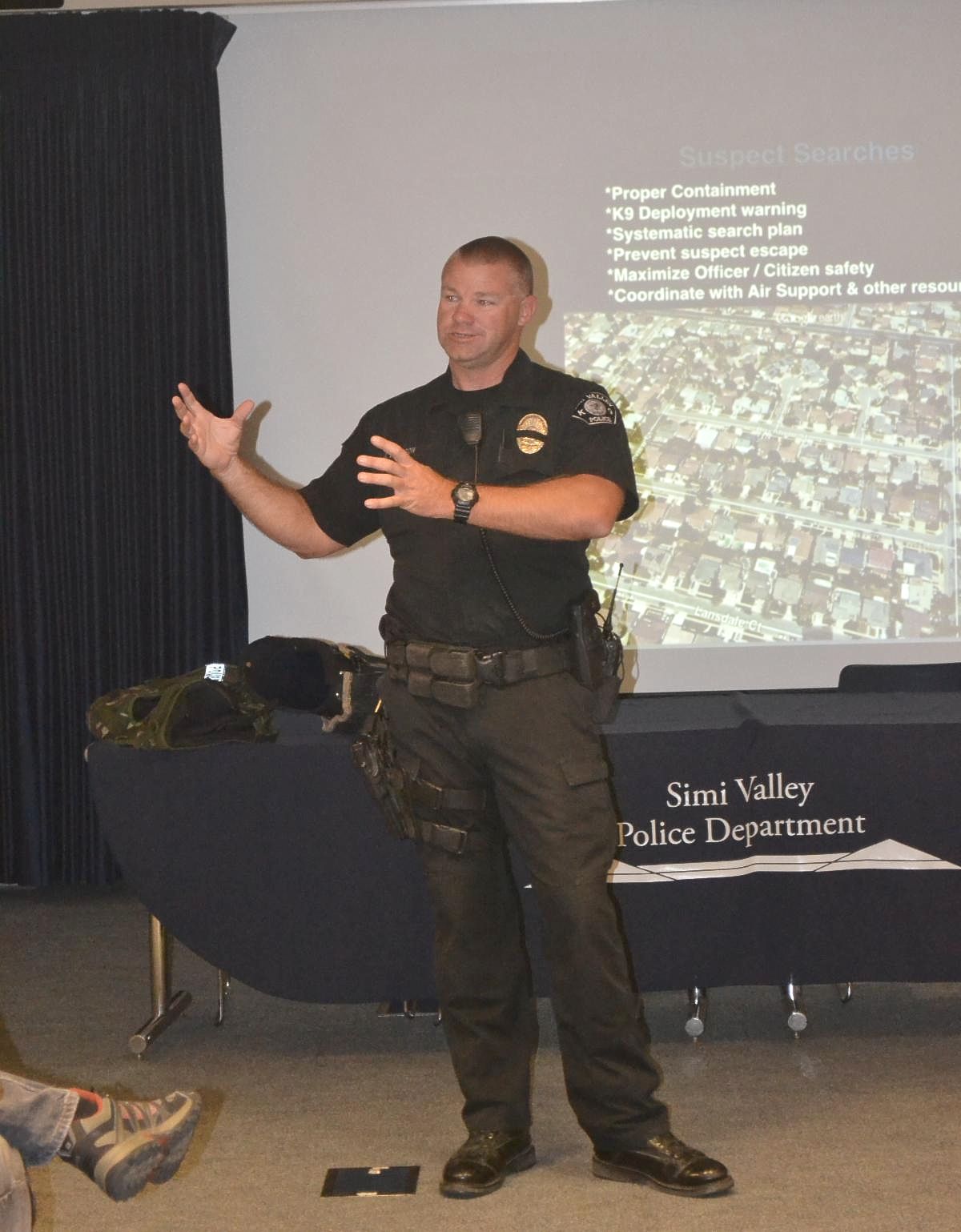 Officer standing and speaking to Citizens Police Academy students inside the Simi Valley Emergency Operations Center 