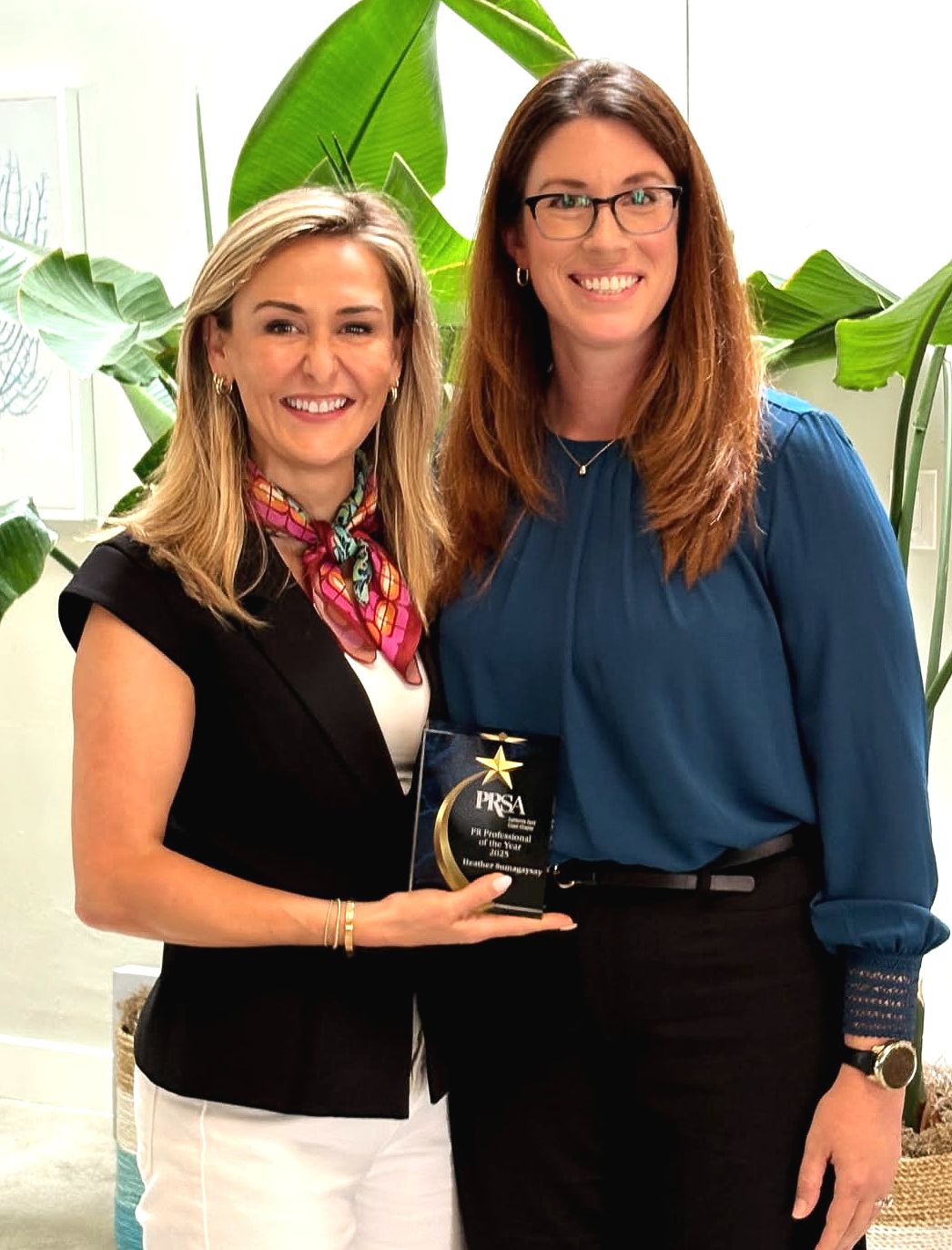 Public Relations Award winner Heather Sumagaysay with Natalie Hernandez from Public Relations Society of Americastands with two leadership panelists