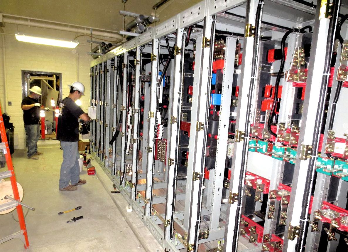 Two instrumentation technicians working inside a facility
