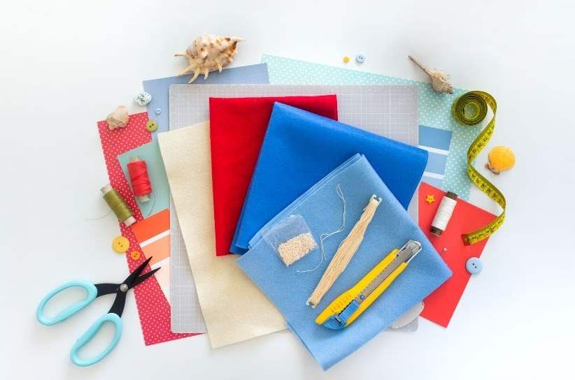 craft and stationary materials on a table.