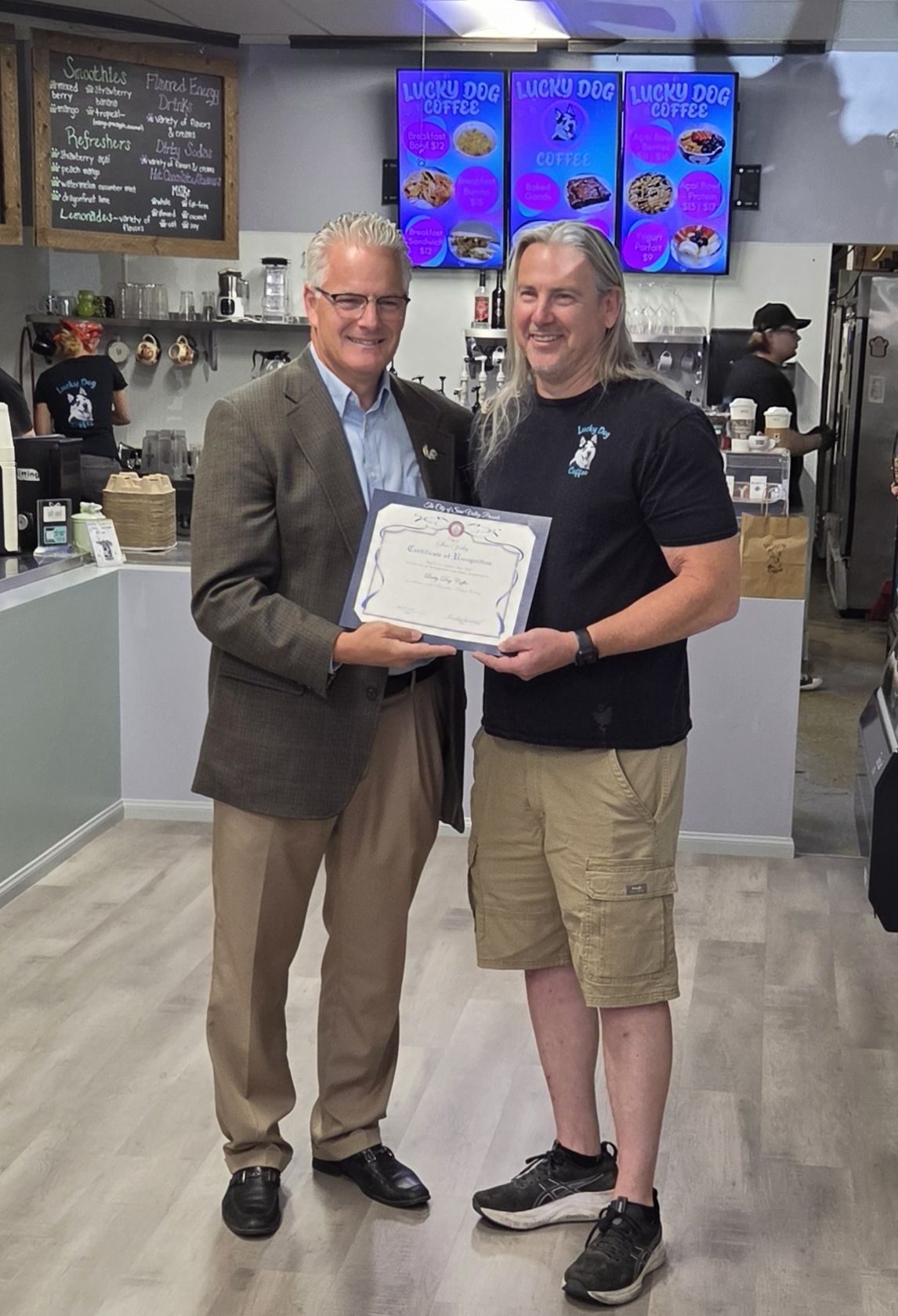 Grand reopening for Lucky Dog Coffee with Council Member Roads and Lucky Dog Coffee Owner