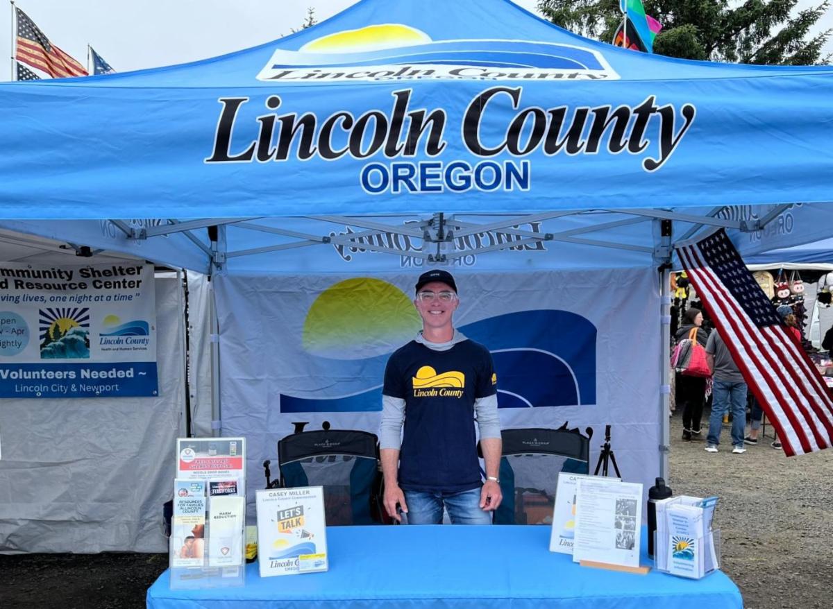 Commissioner Casey Miller at the County booth at the Lincoln County Fair & Rodeo