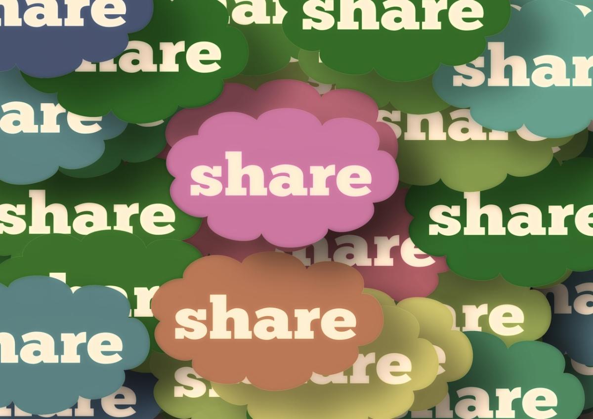 cloud shapes of many different colors with the word share in the middle of each one