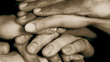 hands_together_sand.jpg