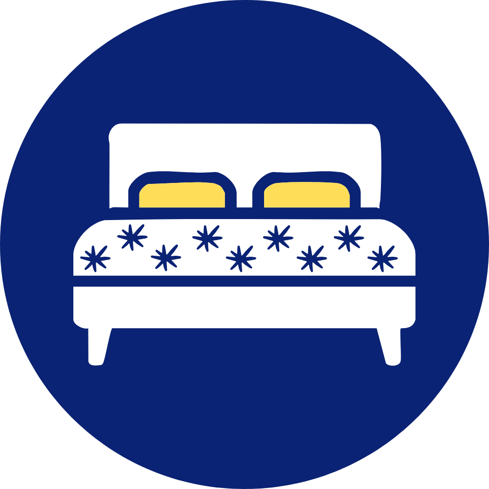 a bed with two pillows