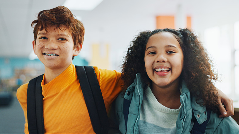Two kids smiling 