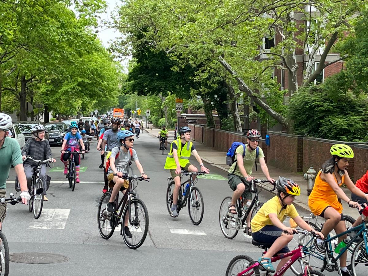 Photo of multiple cyclists on a group ride, as they round a turn.