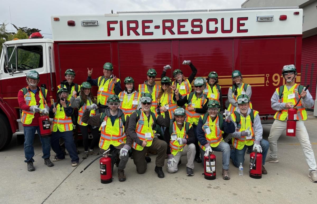 CERT Basic graduates stand in front of a Fire Rescue truck in April 2025