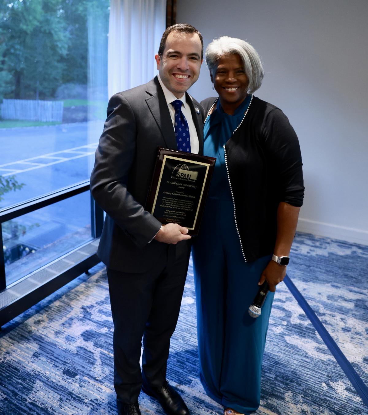 Photo of Carolyn Hayer with awardee Attorney General Platkin