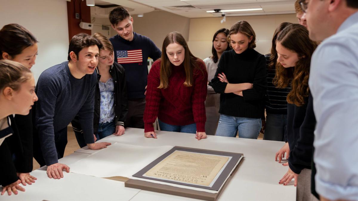 students look at archival documents