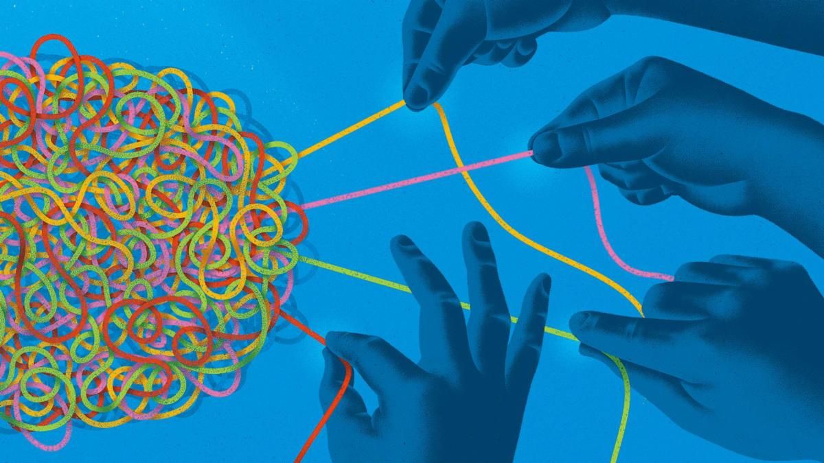 hands pulling at colored thread shaped like a brain