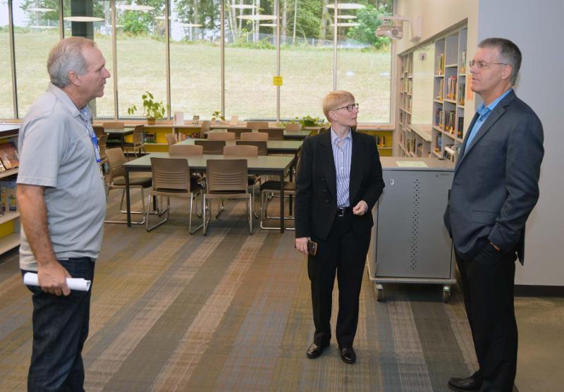 THS Principal Terry Duty and Superintendent Rob Morrow talk with Green River College President Suzanne Johnson