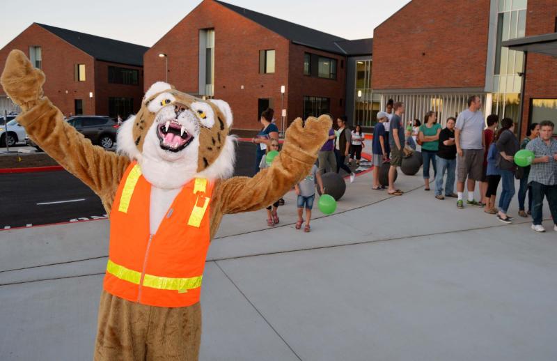 Wildcat mascot greets people outside the new Lake Wilderness Elementary School