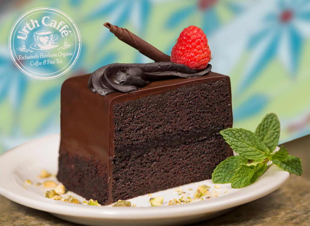 Photo of Urth Caffé Vegan Chocolate Cake, with garnish and Urth logo.
