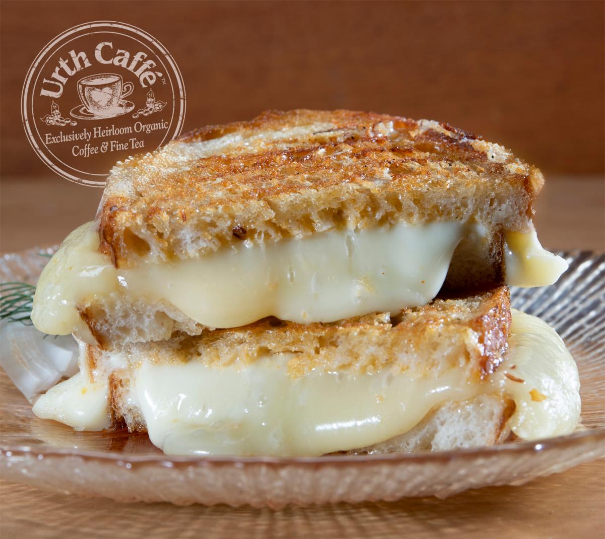 Photo of Urth Caffé Grilled Cheese Panini Front View, with logo and text.