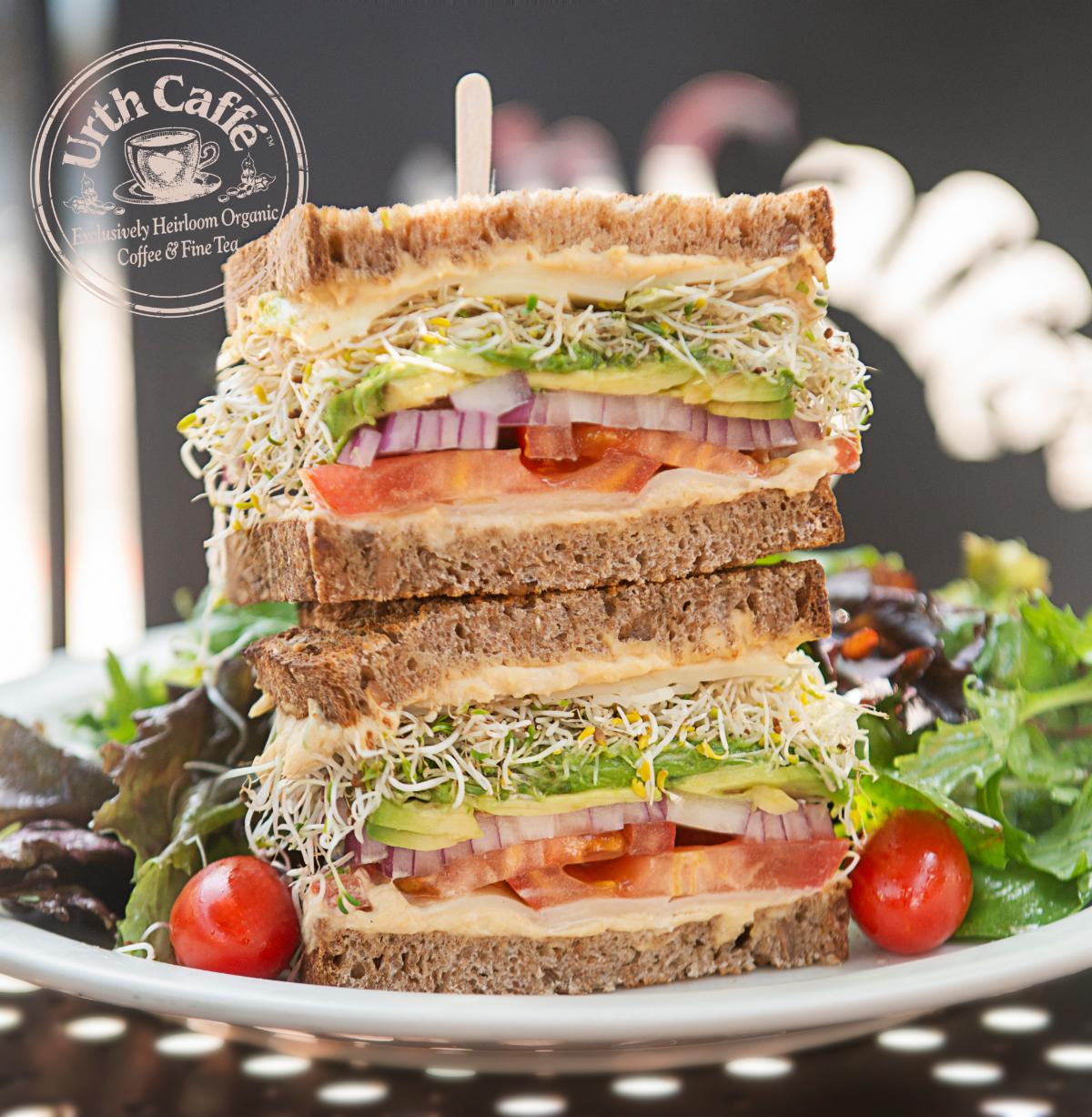 Photo of Urth Caffé Sprout Sandwich with greens and Urth logo. 