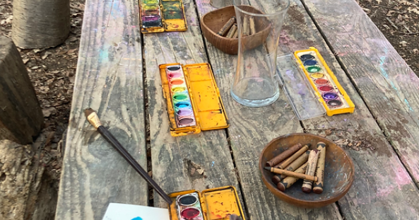 Art supplies on a picnic table