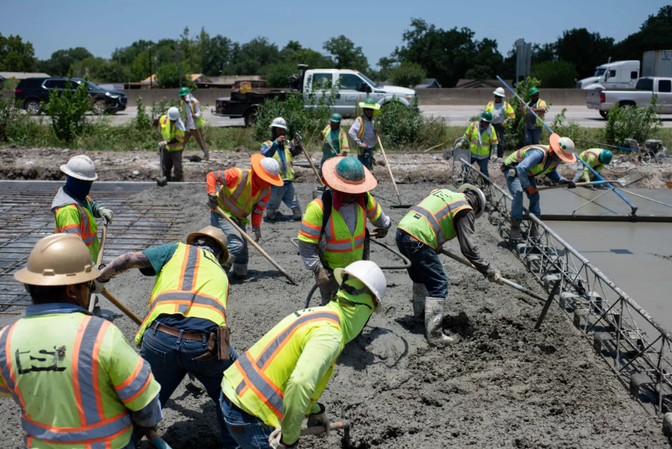 Image of construction workers working on a road.