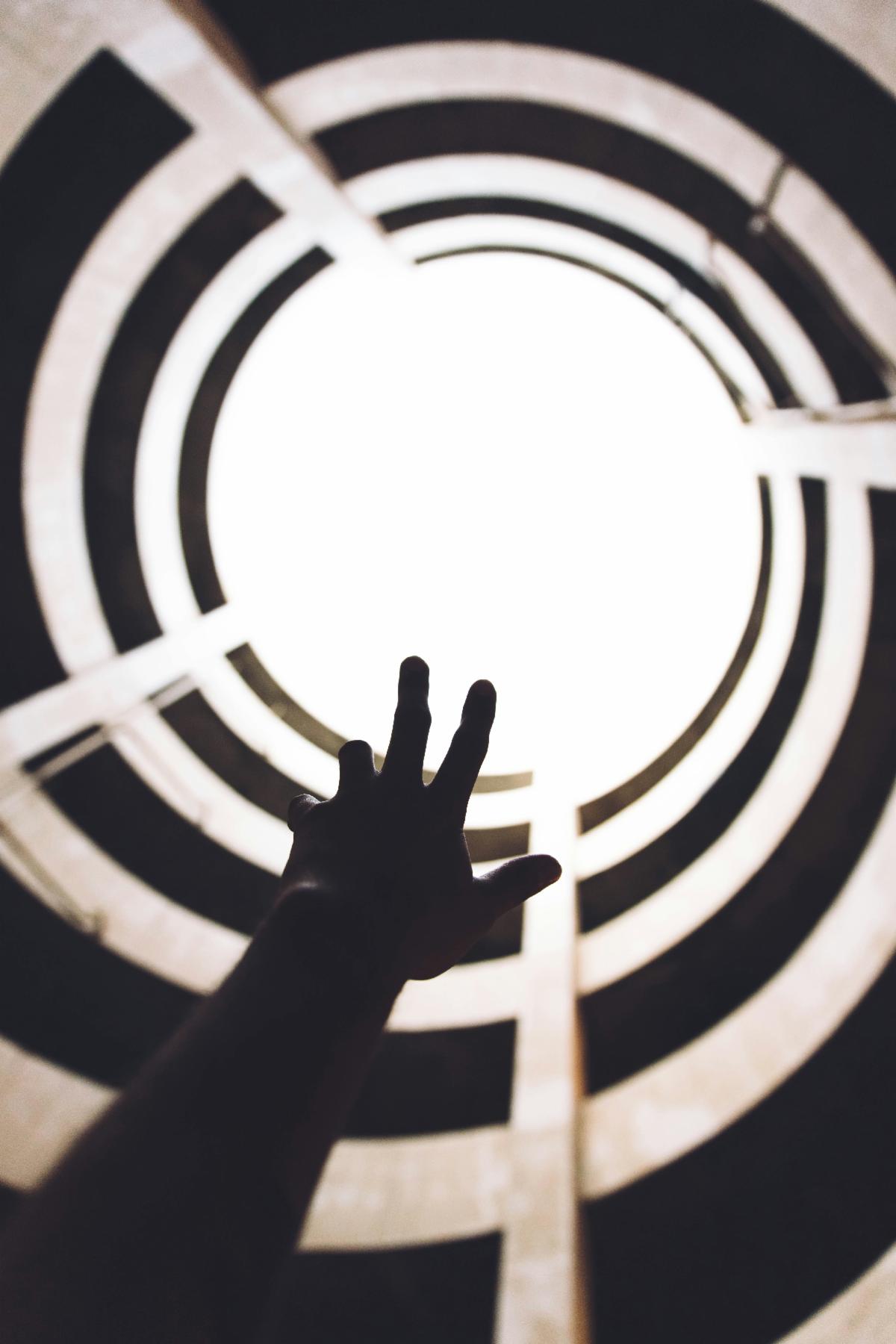 Hand reaching into spiral
