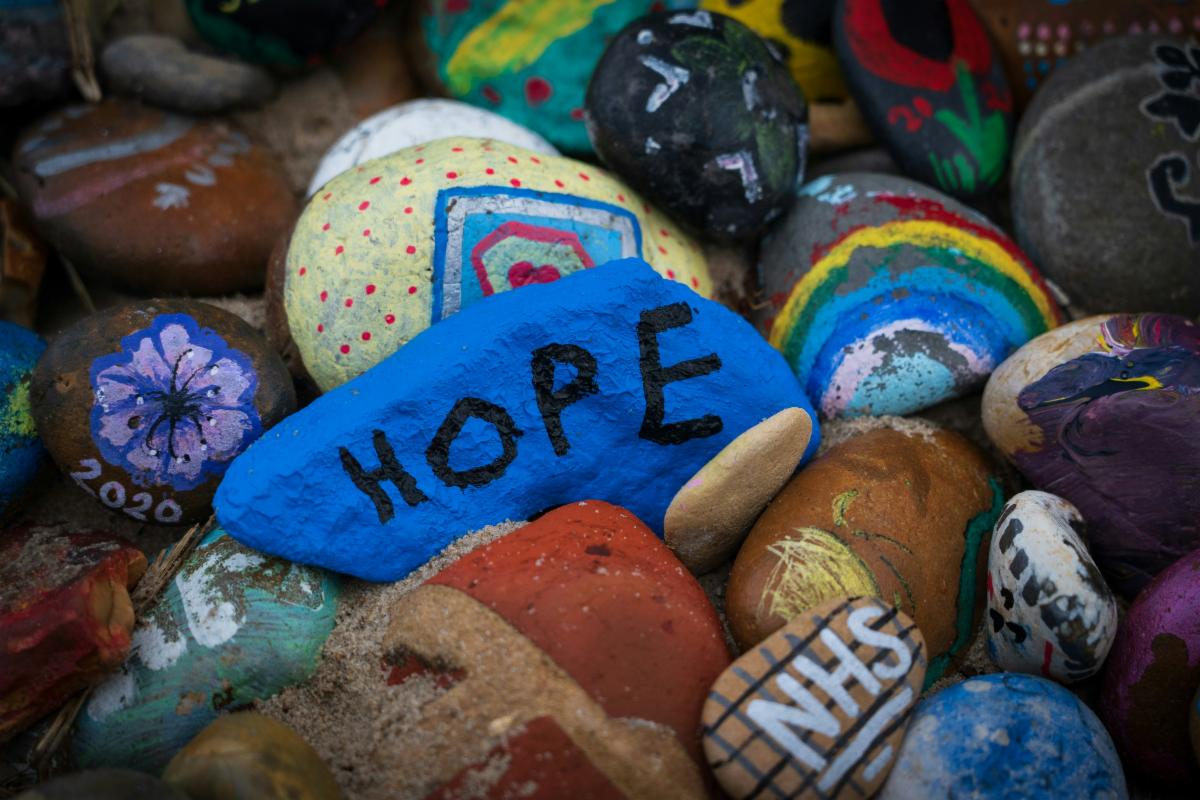 Painted rocks with the word hope on one