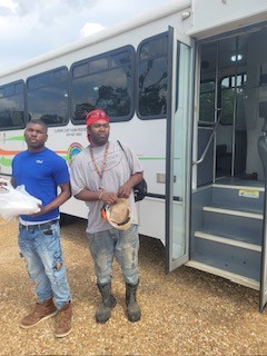 Farmers getting off a Clairborne bus
