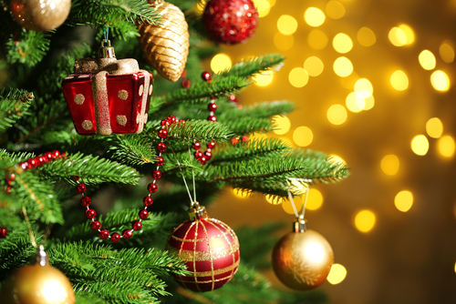 Decorated Christmas tree on  blurred_ sparkling and fairy background