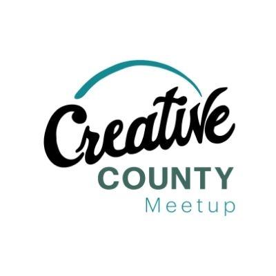 Teal blue arch above the word Creative written in cursive black lettering with the word County below it in all capital letters in blue green and below that the word Meetup in teal
