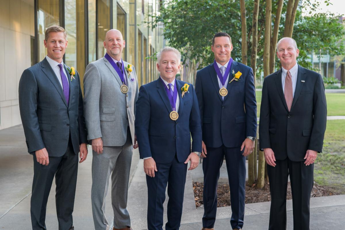 Hall of Distinction honorees posing for a photo with Dean Russell Crook
