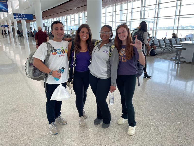 Students in the airport on the way to great woods.