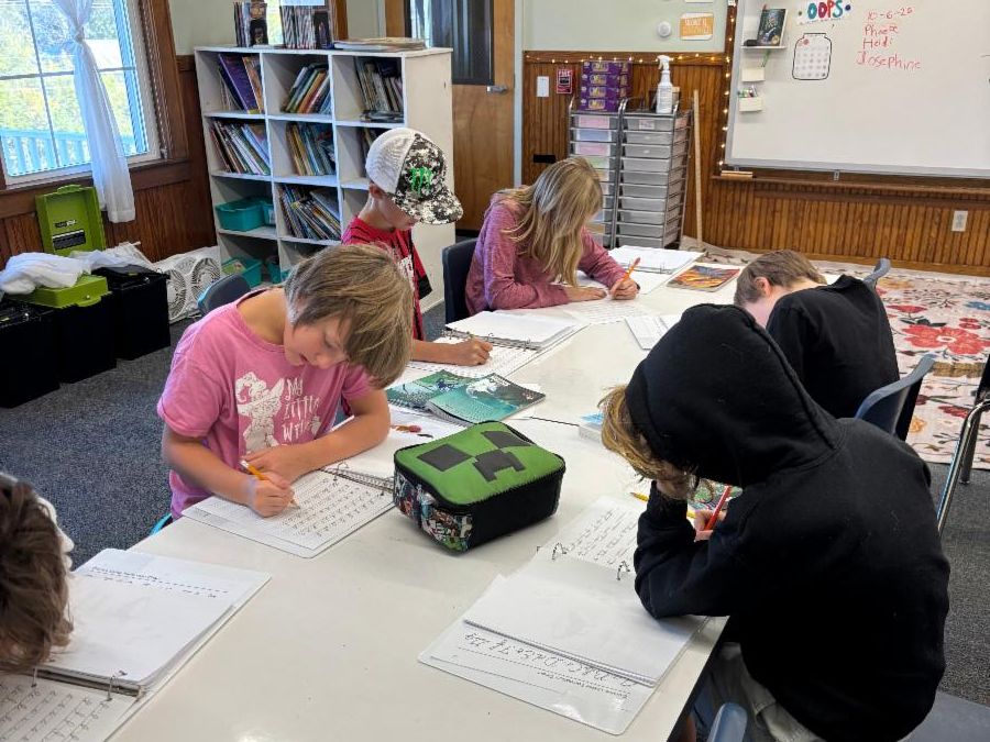 Fourth graders work on writing pieces
