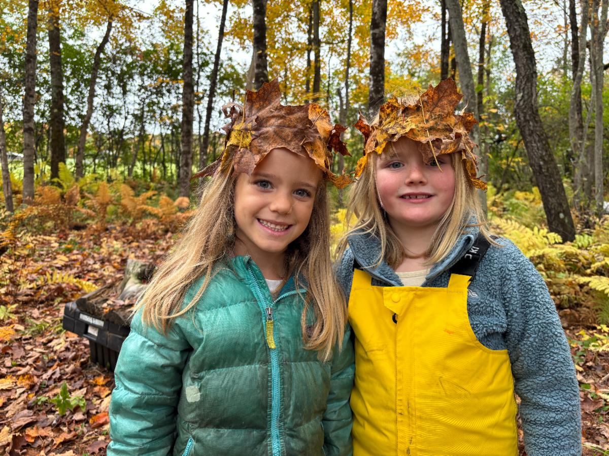 Two Kindergartners wear flower crowns
