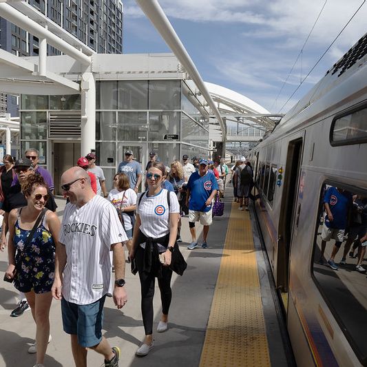 Fans arrive at the commuter rail platform at Denver Union Station.