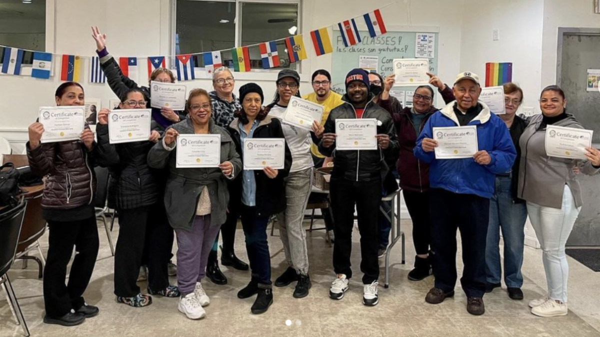 A graduating class of TGH learners smiles with their certificates at MakeIT Haverhill.