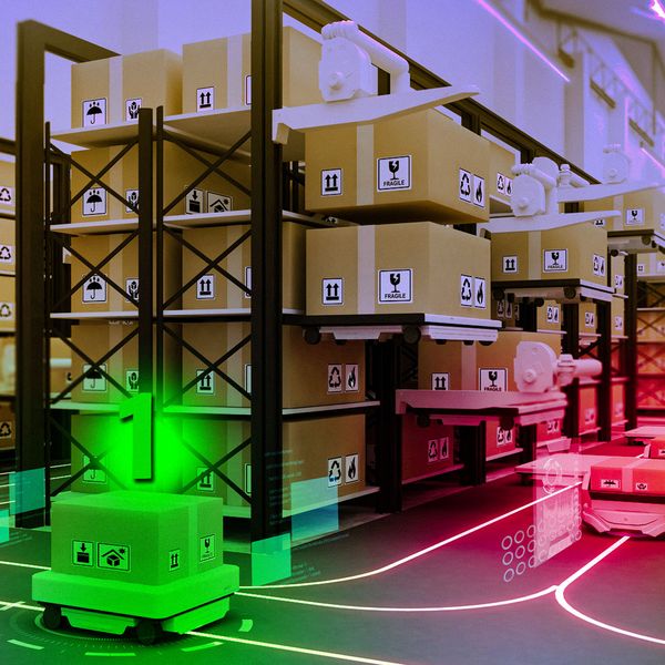 Robots in warehouse, and one green robot has a “1” on it.