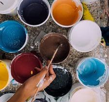 overhead photo of colorful paint buckets