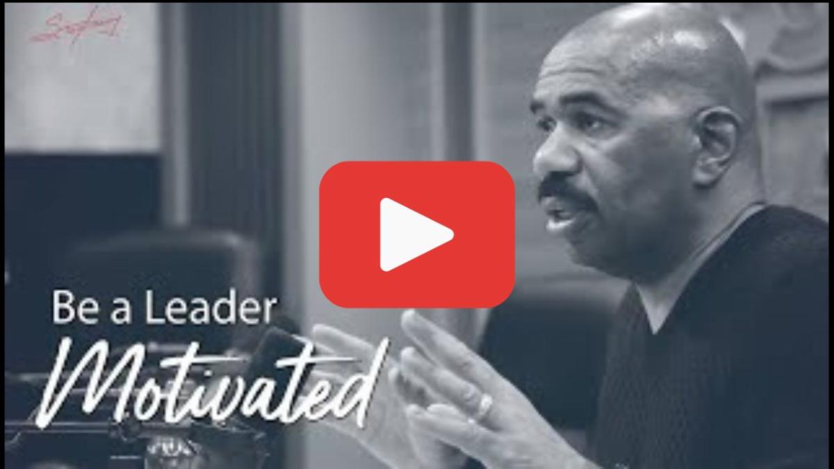 man speaking at a table in black and white image with text that says be a leader motivated and a red play button overlay in the center