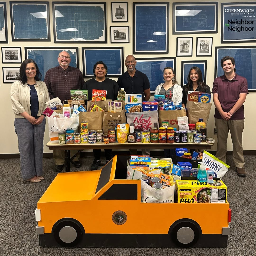 Greenwich Public Works staff pose with donated food collected during the Neighbor to Neighbor Fill-A-Truck food drive.
