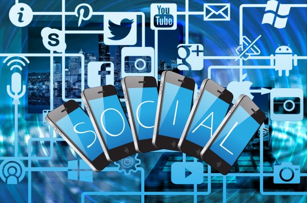 A group of cell phones with social media icons