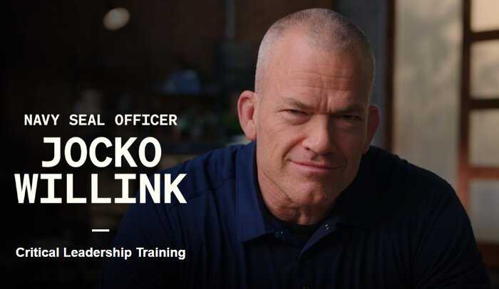 man with short hair wearing a dark shirt looking forward with text that says navy seal officer jocko willink critical leadership training