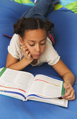 girl reading on floor