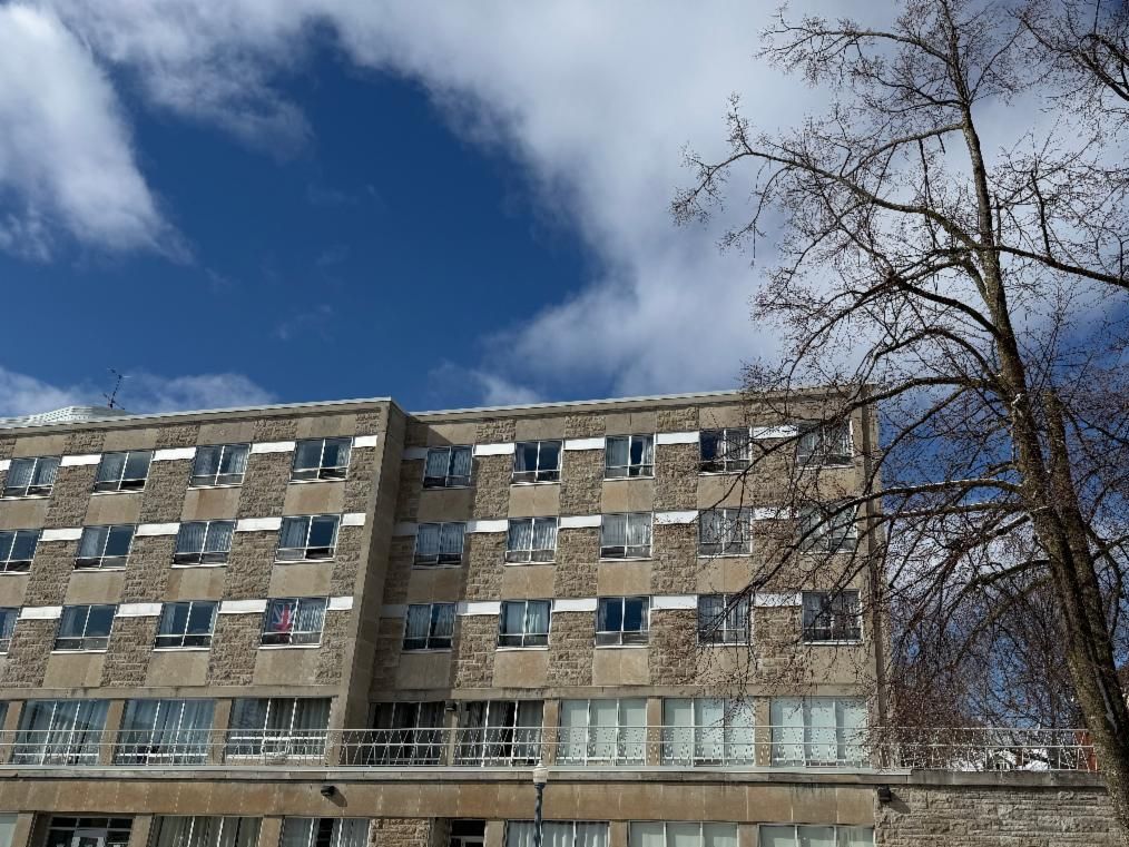Leonard Hall residence exterior windows on a sunny spring day