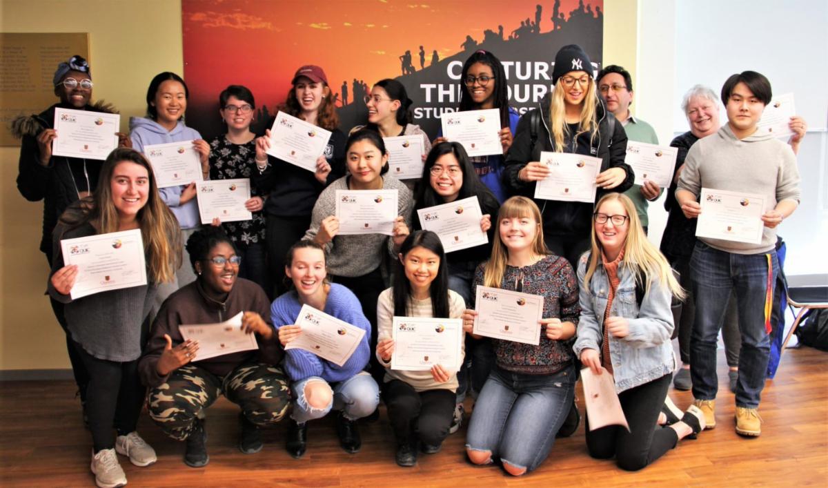 Students holding certificates