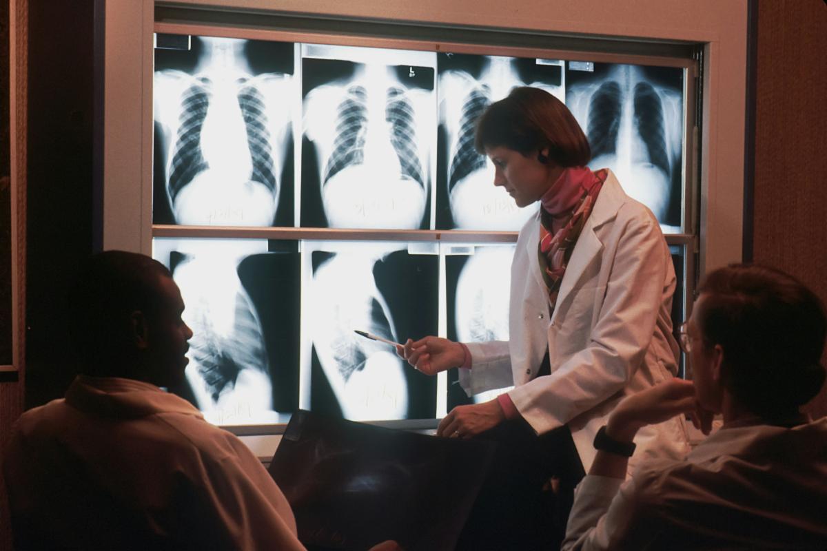 A group of radiologists examine x-rays