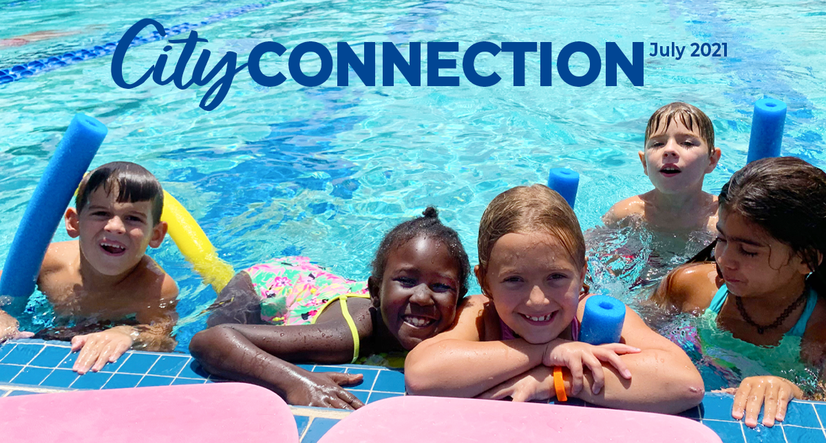 City Connection July 2021. Kids smiling while in pool
